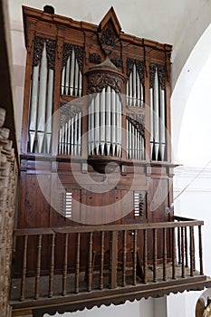Vertical view of the 18th century pipe organ of the Santiago el Mayor church in Castano del Robledo, Huelva, Spain photo