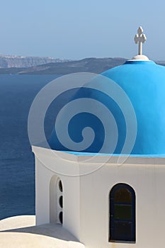Vertical view of typical greek church in Oia town - Santorini