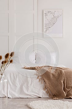 Vertical view of white bedroom interior, real photo