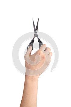 Vertical view of a woman hand using a scissors