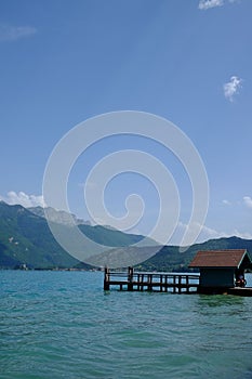 Vertical view of a wooden lakehouse cabin on Lake Annecy, France