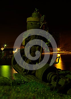 Vertical vintage ship engine on the beach bokeh background backd