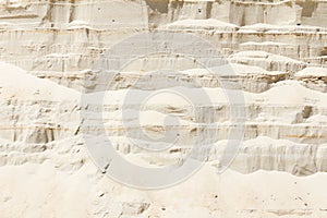 Vertical wall of sand in sand pit