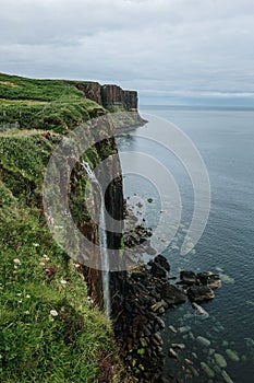 Vertical of a a waterfall on a cliff  on the Isle of Skie island in Scotland