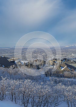 Vertical Whispy white clouds High angle view of Draper residential area in Utah