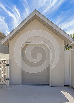 Vertical Whispy white clouds Tool shed with clipped edge entrance and sectional door