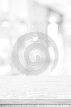 Vertical white table presentation, desk and blur background, Empty wood counter, shelf surface over blur restaurant white bokeh