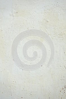 Vertical whitewashed uneven wall photo