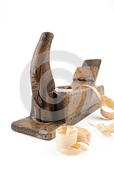 Vertical, wide angle studio shot of small vintage wood planer isolated on white background. Old carpenter tool with wood