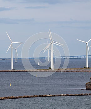 Vertical wind turbine generators and bridge