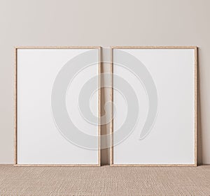 Vertical wooden frame mock up on beige floor. Set of two wooden frame mock up poster. Two vertical frame