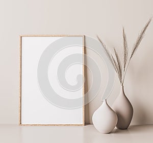 Vertical wooden frame mock up. Wooden frame poster, and simple vase with pampas on beige wall photo