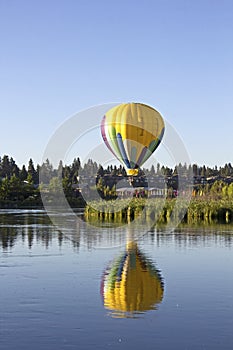 Vertical Yellow Hot Air Ballon Reflection