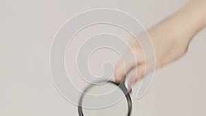 Vertical zooming glass exploring lens woman hand