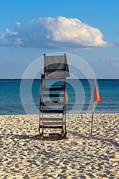 Vertically exposed closeup of abandoned lifeguard post on white