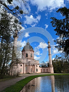 Verticals hot of the historic Schwetzingen Palace near a pond in Germany