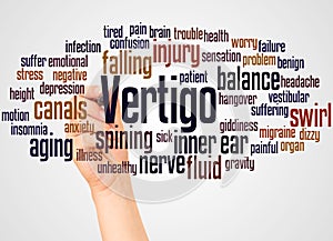 Vertigo word cloud and hand with marker concept photo