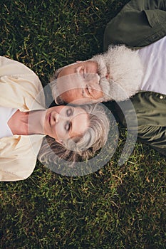 Vertival photo of rest pensioner grey hair couple wear trend shirts outside spend free time