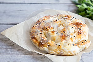 Vertuta, traditional Romanian, Moldavian or Balkan baking pie. Spiral filo pastry pie photo