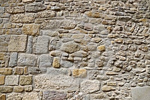 Very ancient stone wall, closeup texture