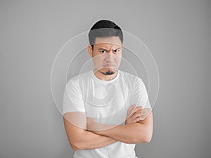 Very angry aggressive man portrait in white t-shirt.