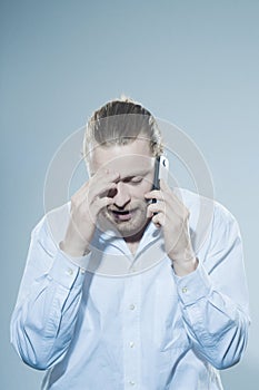 Very angry man on telepone