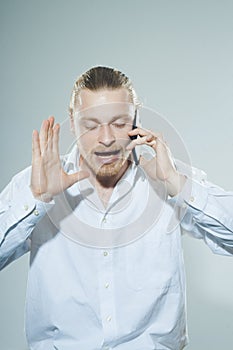 Very angry man on telepone