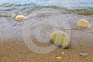 Very beautiful background or backdrop of huge pebbles on the resort beach, selective focus with copy space