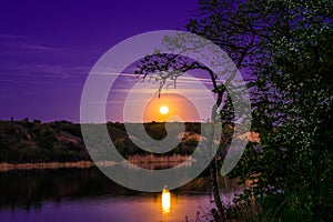 Very beautiful and colorful night and evening landscapes over the river Seversky Donets in the Rostov region. A rich moonlit sunse