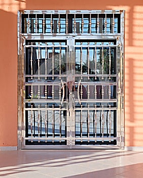 Very beautiful door, made in the most modern style of mirror glass and metal elements with a shiny polished surface