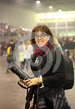 Very beautiful female photographer at live concert