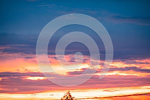 Very beautiful landscape of the evening sky with clouds, sunset. Blue, orange sky