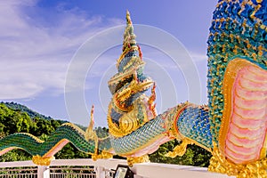 A very beautiful Naga a very great serpent statue surrounding the pagoda at Doi Thepnimit temple on Patong hilltop