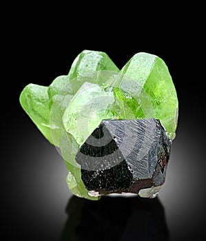 very beautiful peridote crystal with magnetite mineral specimen from supat Kohistan Pakistan photo