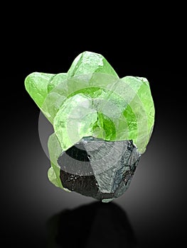 very beautiful peridote crystal with magnetite mineral specimen from supat Kohistan Pakistan photo