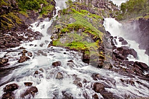 Very beautiful waterfall in Norway with fast-flowing water, big
