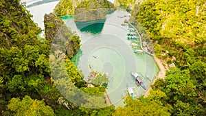 Very beautyful lagoon with boats. Paradise islands in Philippines. Kayangan Lake. Fisheye view.