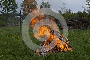 Big camp fire on the meadow
