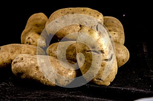 A very big stack of white potato` looking back at you