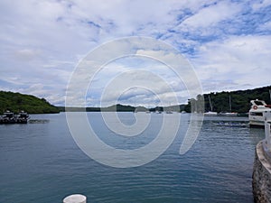 very calm sea surrounded by islands