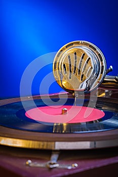 Very close up view on gramophone on blue background