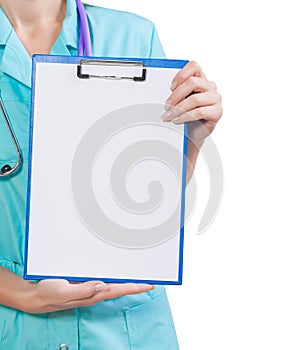 Very close up view hands of female doctor holding clipboard with