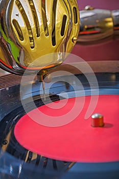 Very close up view on speaker and vinil disk of gramophone