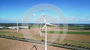 Very close up Wind energy turbine. Dramatic aerial view flight havelland