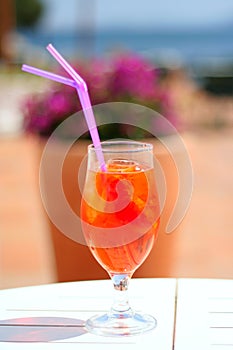 Very colorful drink as an aperitif in a bar by the sea