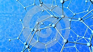 Very complex structure formed by tubes and spheres as molecules with depth of field on blue background