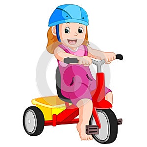 very cute girl on tricycle