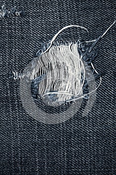 Very detailed hi res photo of denim with hole