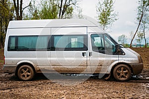 Very Dirty Car Minivan Stalled In The Mud