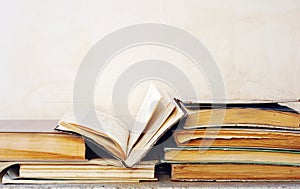 Very dirty discarded books, one book opened